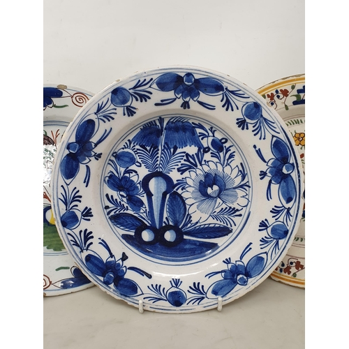 504 - A blue and white Delft Bowl with floral designs, 9in, two Delft Bowls with polychrome stylised flora... 