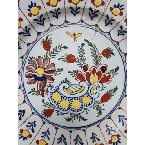 506 - A large antique Delft Bowl with floral multi borders, the centre with stylised floral decorations (A... 