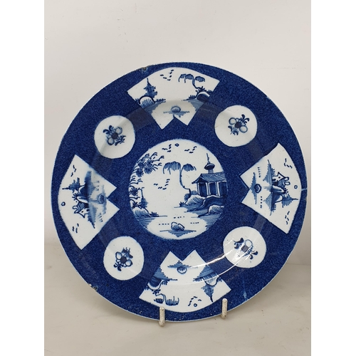 509 - Three 18th Century porcelain Plates/Dishes with powder blue ground, each with pagoda, landscape and ... 