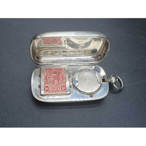 51 - A George V silver combined Sovereign and Stamp Case with engine turned decoration and vacant cartouc... 