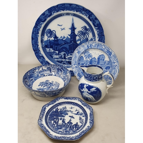 510 - A large blue and white 'Leeds Pottery' Charger with floral and scrolled rim, the centre decorated wi... 