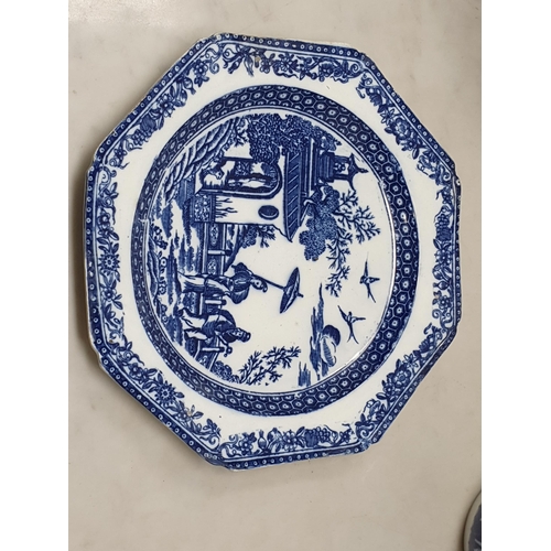 510 - A large blue and white 'Leeds Pottery' Charger with floral and scrolled rim, the centre decorated wi... 