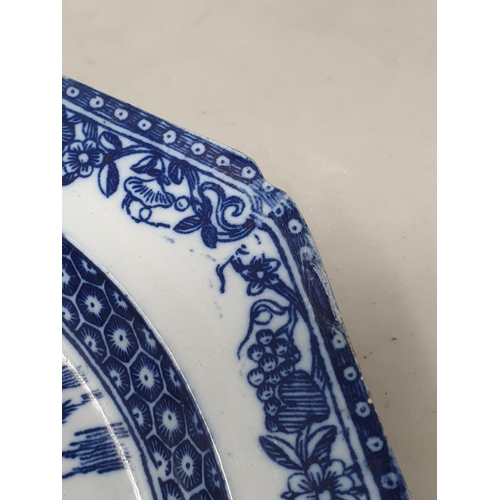 510 - A large blue and white 'Leeds Pottery' Charger with floral and scrolled rim, the centre decorated wi... 