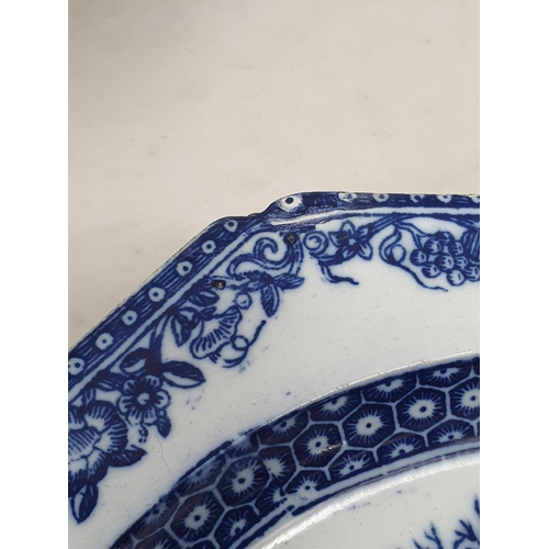 510 - A large blue and white 'Leeds Pottery' Charger with floral and scrolled rim, the centre decorated wi... 