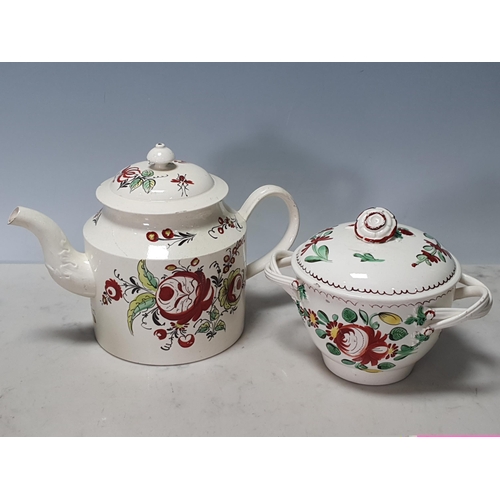 514 - A creamware Teapot with painted floral sprays decoration and leafage moulded decoration on the spout... 