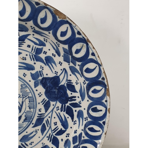 519 - An antique blue and white Delft Plate/Dish with multi borders and stylised floral sprays, the centre... 