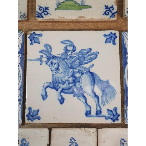 520 - A collection of Delft and other tiles including two floral decorated Dutch tiles, a set of six blue ... 