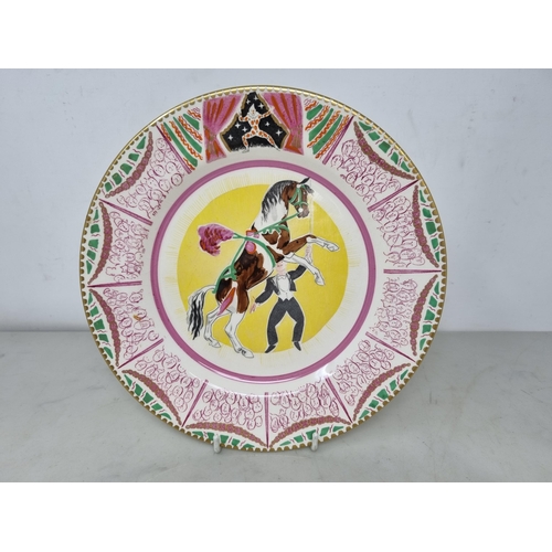 536 - Clarice Cliff Bizarre Plate, designed by Dame Laura Knight, a circus design, Plate with figure and d... 