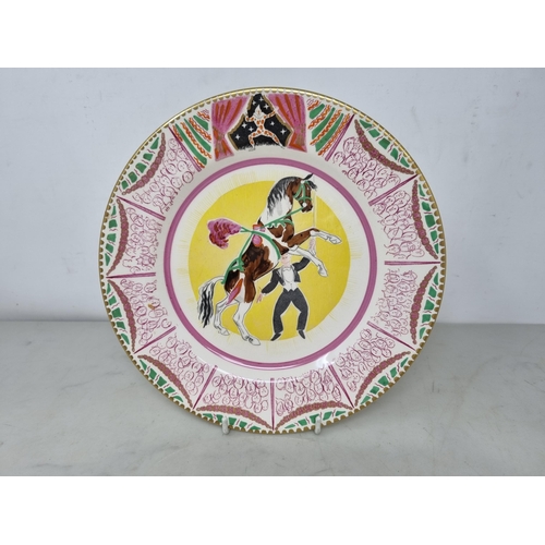 536 - Clarice Cliff Bizarre Plate, designed by Dame Laura Knight, a circus design, Plate with figure and d... 