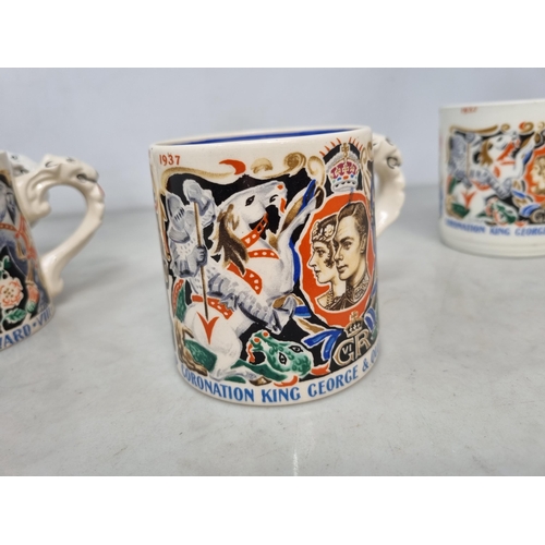 543 - Four Coronation Mugs for the Coronation of King George VI and Queen Elizabeth designed by Dame Laura... 