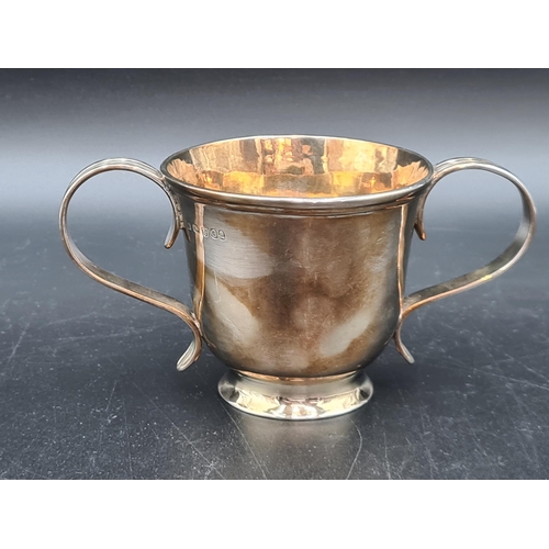 55 - A George III silver two handled Cup with reeded handles on pedestal base, London 1809