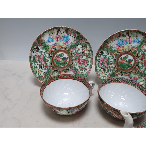 554 - A 19th Century Cantonese part Tea Set including Tea Pot and three Cups and Saucers with panels of bi... 