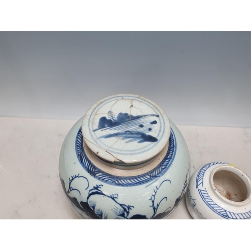 556 - A Chinese blue and white Ginger Jar and Cover, decorated buildings in a landscape, 9in H, and two sm... 