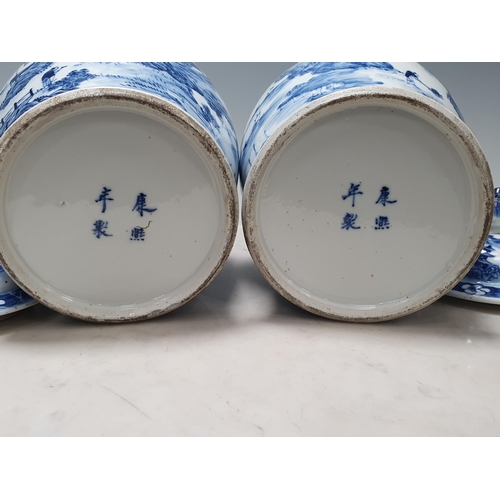 557 - A pair of Chinese blue and white Jars and Covers of baluster form with design of figures and animals... 