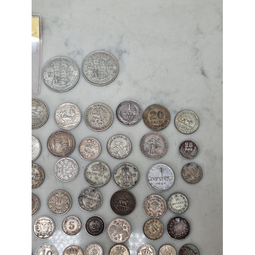 590 - A collection of World silver Coins, to include issues from Sweden, Italy, India, Russian Empire, USS... 