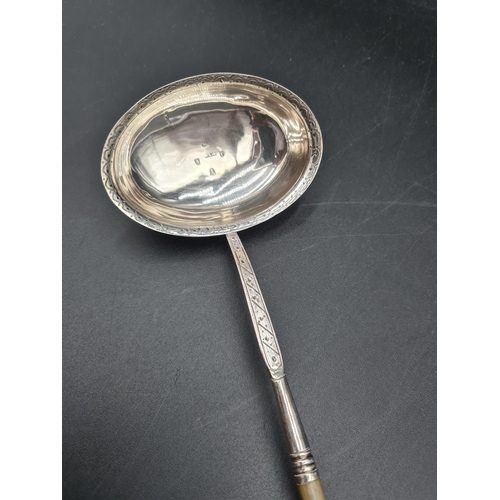 60 - A George III Toddy Ladle with bright cut oval  bowl engraved initials, spiral whalebone handle, Lond... 