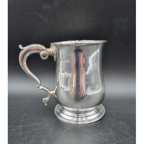 61 - A George V silver baluster Pint Mug with  presentation inscription and scroll handle, Chester 1923, ... 