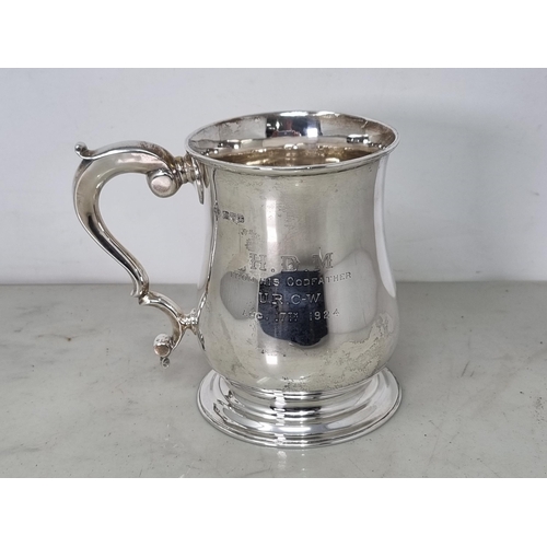 61 - A George V silver baluster Pint Mug with  presentation inscription and scroll handle, Chester 1923, ... 