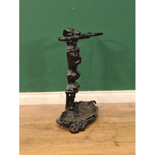 610 - An antique cast iron Stick Stand in the form of a seated dog with a whip in it's mouth 2ft H x 1ft 1... 