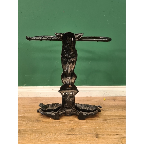 610 - An antique cast iron Stick Stand in the form of a seated dog with a whip in it's mouth 2ft H x 1ft 1... 