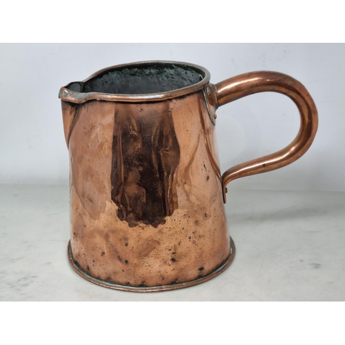 615 - An antique copper Beer Muller with handle, 10in L, and an antique Beer Jug with engraved crest, 9in ... 