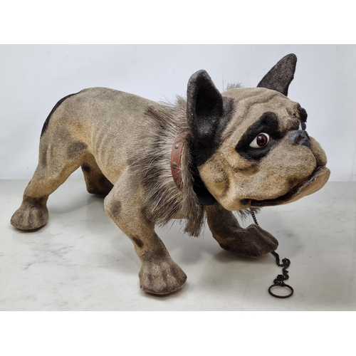 619 - A papier maché and felted French Bulldog, nodding head, articulated jaw, on wooden casters and with ... 