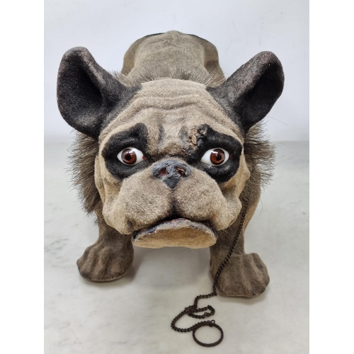 619 - A papier maché and felted French Bulldog, nodding head, articulated jaw, on wooden casters and with ... 