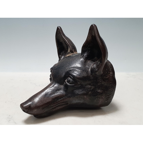 621 - A cast metal Door Stop in the form of a fox mask 6 1/4in L