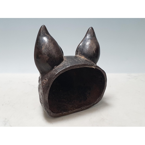 621 - A cast metal Door Stop in the form of a fox mask 6 1/4in L