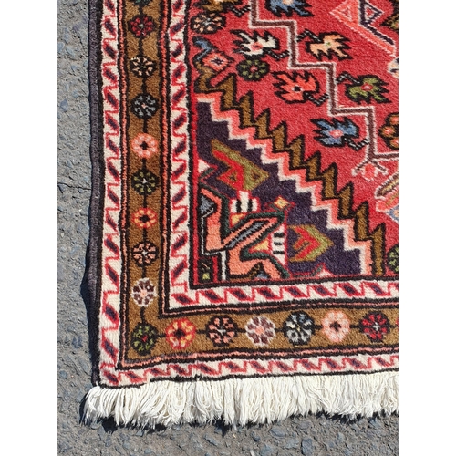 631 - A Persian/Iranian Runner, with floral multi borders, the centre with geometric design motifs and sty... 