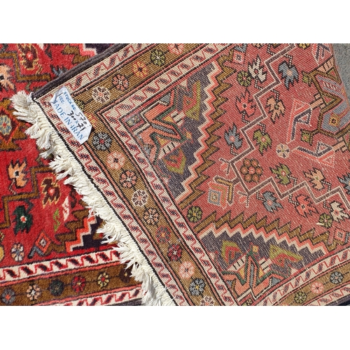 631 - A Persian/Iranian Runner, with floral multi borders, the centre with geometric design motifs and sty... 