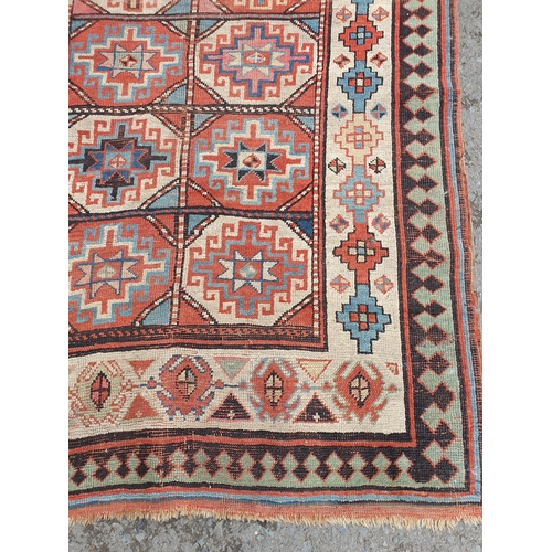 632 - An antique  bordered Shirvan Runner, the central field with two rows of thirteen guls with latch hoo... 