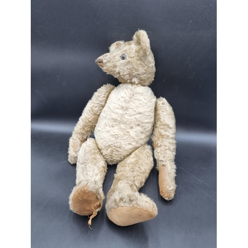 649 - An early 20th Century Teddy Bear by J F Klarner with original pads, pointed snout, 25in