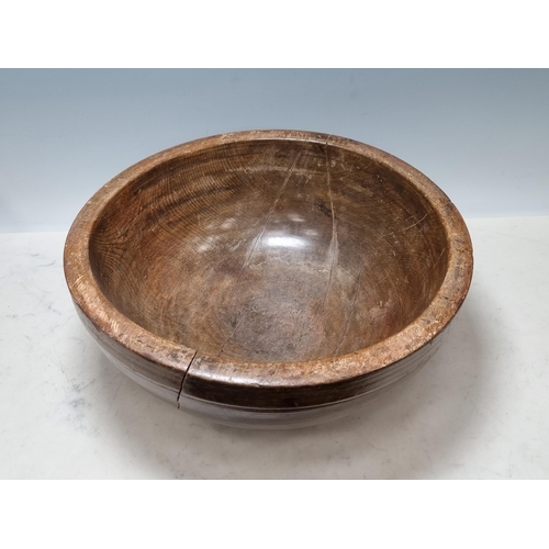 651 - An antique treen Bowl (split through centre) 1ft 4in D