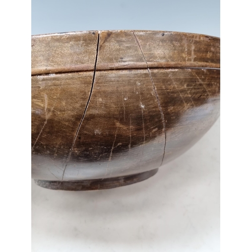 651 - An antique treen Bowl (split through centre) 1ft 4in D