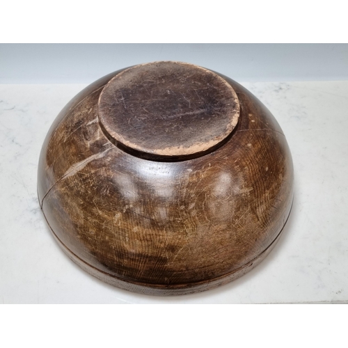 651 - An antique treen Bowl (split through centre) 1ft 4in D