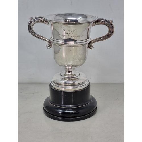 66 - A George V silver two handled Trophy with engraved inscription, Chester 1931, 290gms, on ebonised pl... 