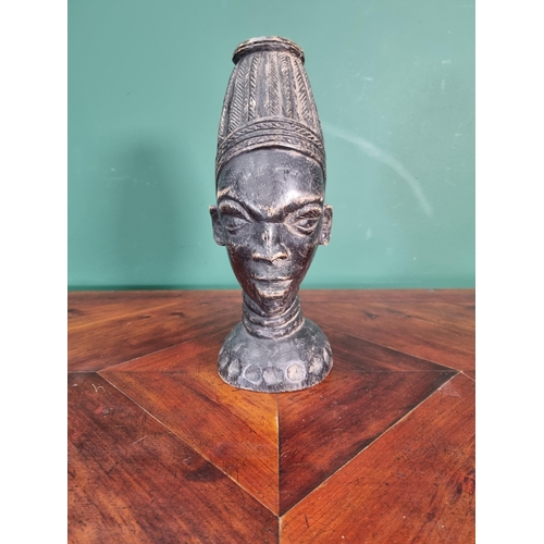 666 - An East African carved Head of a male tribesman with plaited hair 10 3/4in H