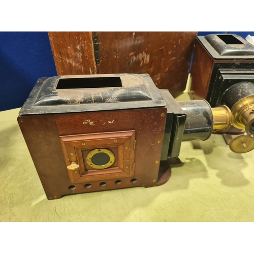 691 - Two Magic Lanterns converted to electricity with metal and brass mounts, in a fitted box