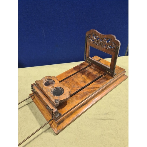 695 - A Victorian walnut Monoscope and Stereoscope Viewer, shows pictures in depth with magnifying glass a... 