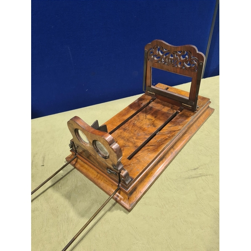 695 - A Victorian walnut Monoscope and Stereoscope Viewer, shows pictures in depth with magnifying glass a... 