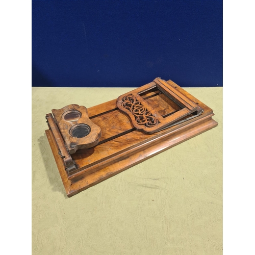 695 - A Victorian walnut Monoscope and Stereoscope Viewer, shows pictures in depth with magnifying glass a... 