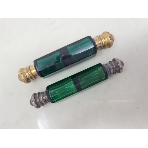 77 - Two green glass double-ended Scent Bottles with gilt metal lids