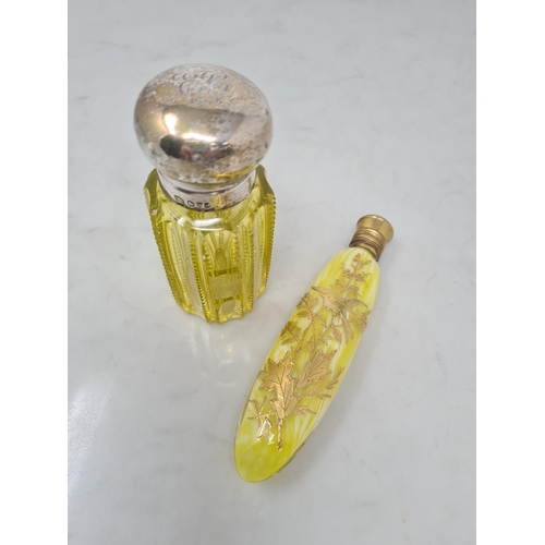 78 - An Edward VII silver lidded yellow glass Scent Bottle engraved initials, Chester 1908, and an opalin... 