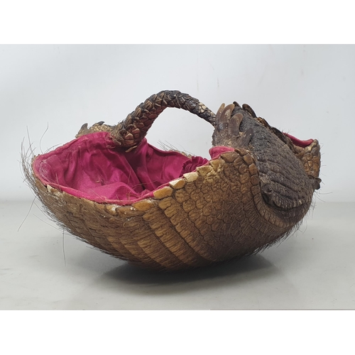 855 - An antique taxidermy Armadillo Basket with pink silk lining 8in L