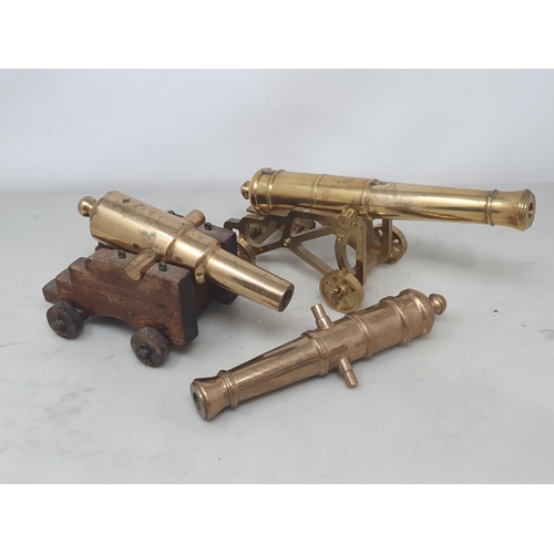 857 - Three turned brass model Desk Canons