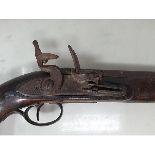 858 - An 18th Century Flintlock Pistol by Henry Nock with walnut grip, the iron lock plate stamped H. Nock... 