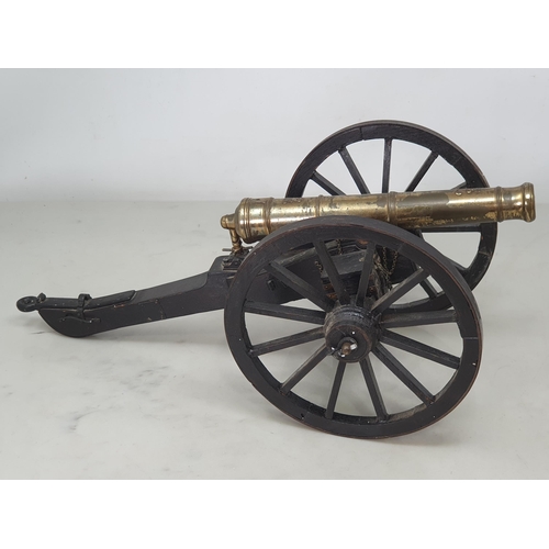 859 - A 20th Century model of a Napoleonic Field Gun, the stained wooden carriage with pair of large spoke... 