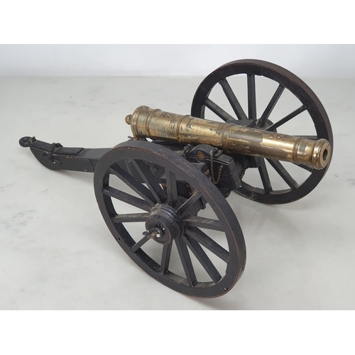 859 - A 20th Century model of a Napoleonic Field Gun, the stained wooden carriage with pair of large spoke... 