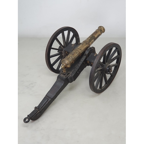 859 - A 20th Century model of a Napoleonic Field Gun, the stained wooden carriage with pair of large spoke... 